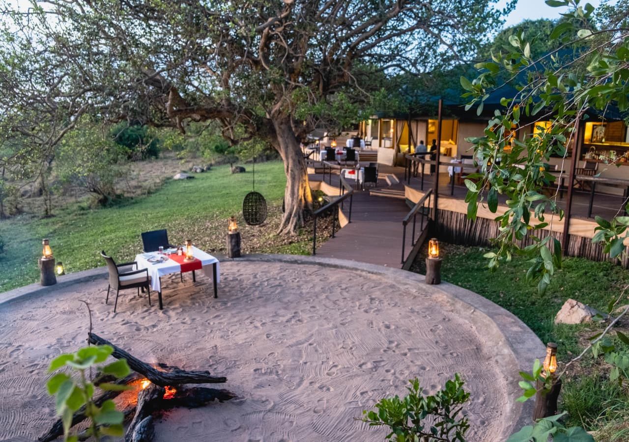 Lemala kuria hills lodge outdoor dining beside the firepit 1280