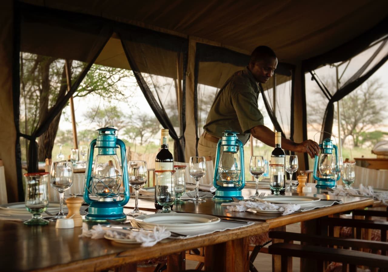 Serengeti safari camp dinner setup 1280