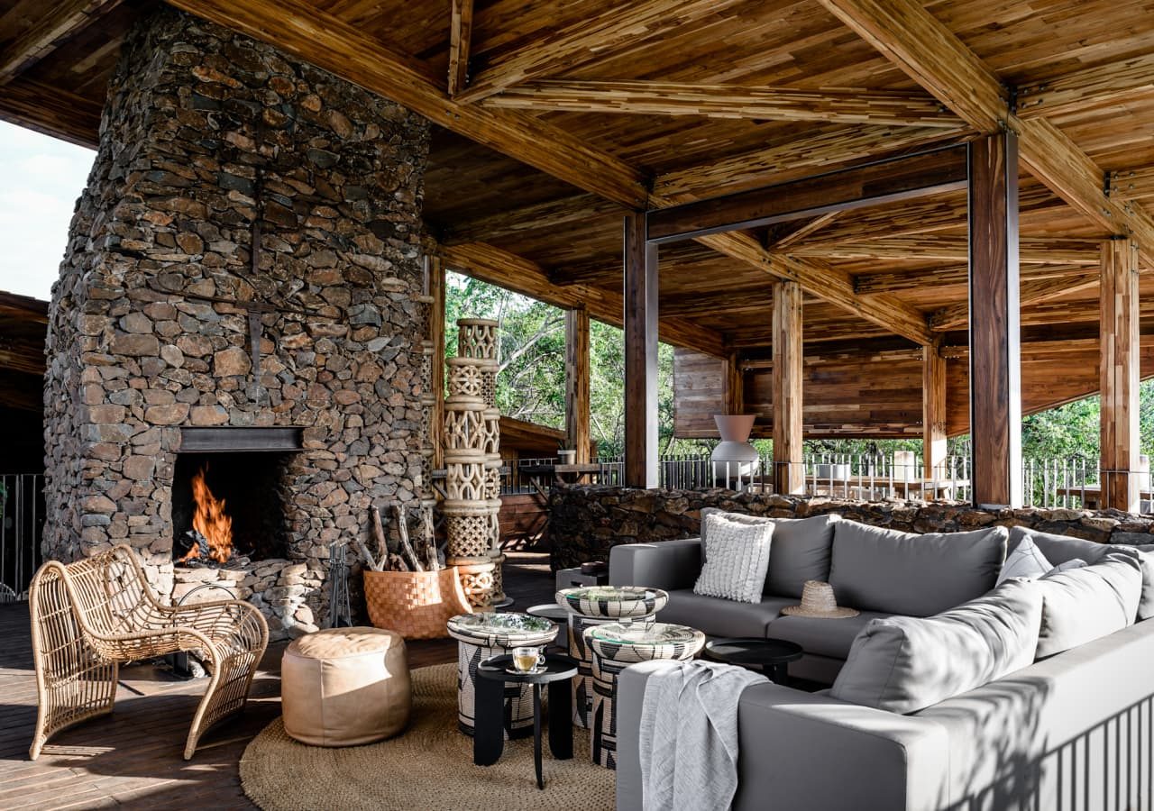 Singita faru faru lodge lodge lounge with a fireplace 1280