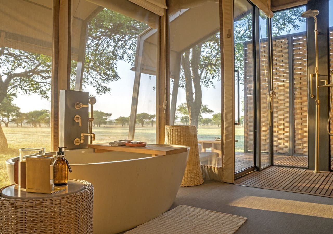 Singita sabora tented camp tented bathroom with a bathtub 1280