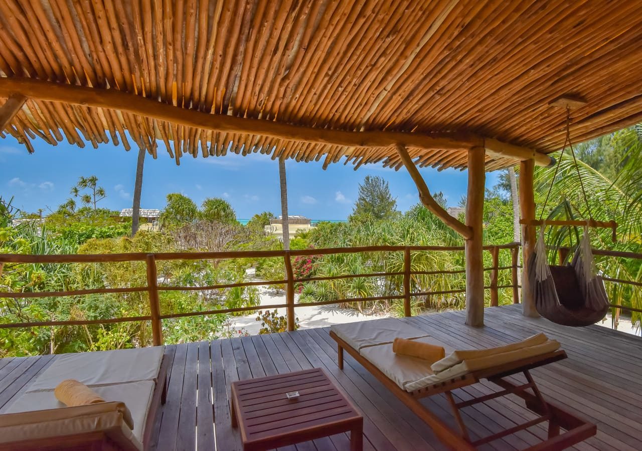 Zanzibar white sand luxury villas and spa private terrace with a garden view 1280