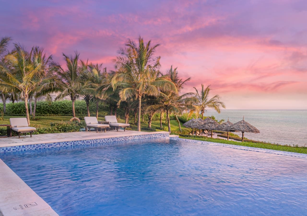 Zawadi hotel sunset at the infinity pool 1280