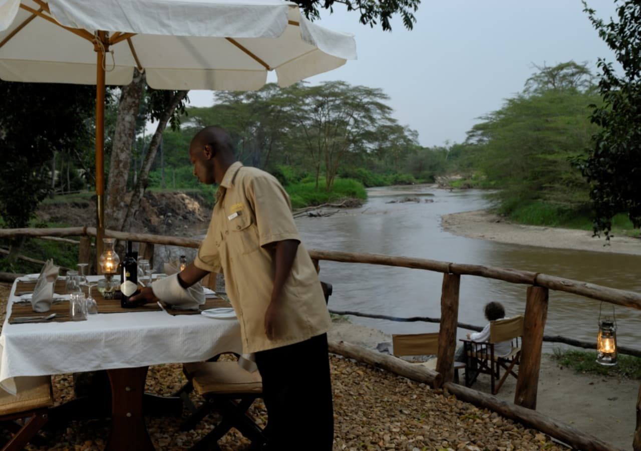 Ishasha wilderness camp dining by the river 1280