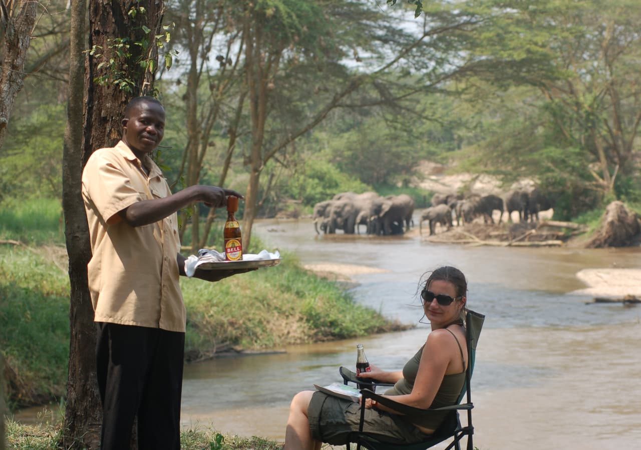 Ishasha wilderness camp watching the elephants by the river 1280