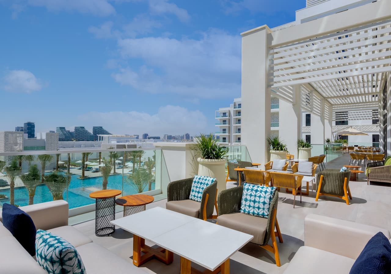 Hilton abu dhabi yas island terrace bar overlooking the pool 1280