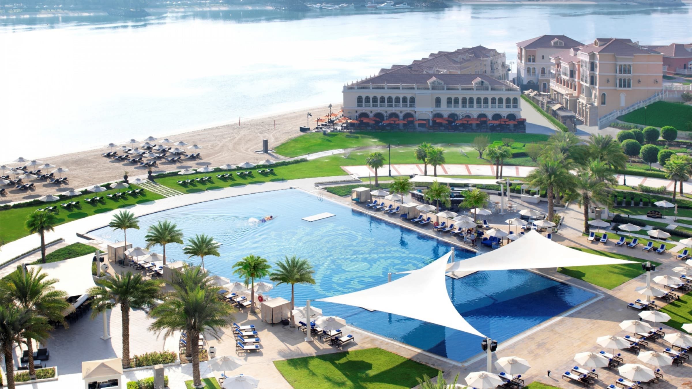 The ritz carlton abu dhabi grand canal aerial pool and beach view 2400