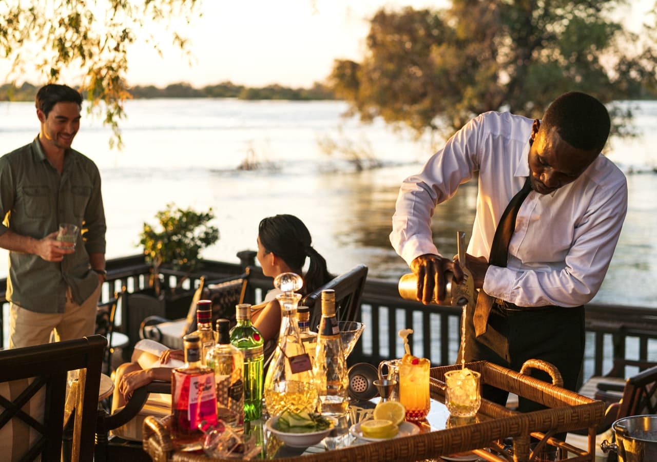 The royal livingstone hotel by anantara sundowners by the water 1280