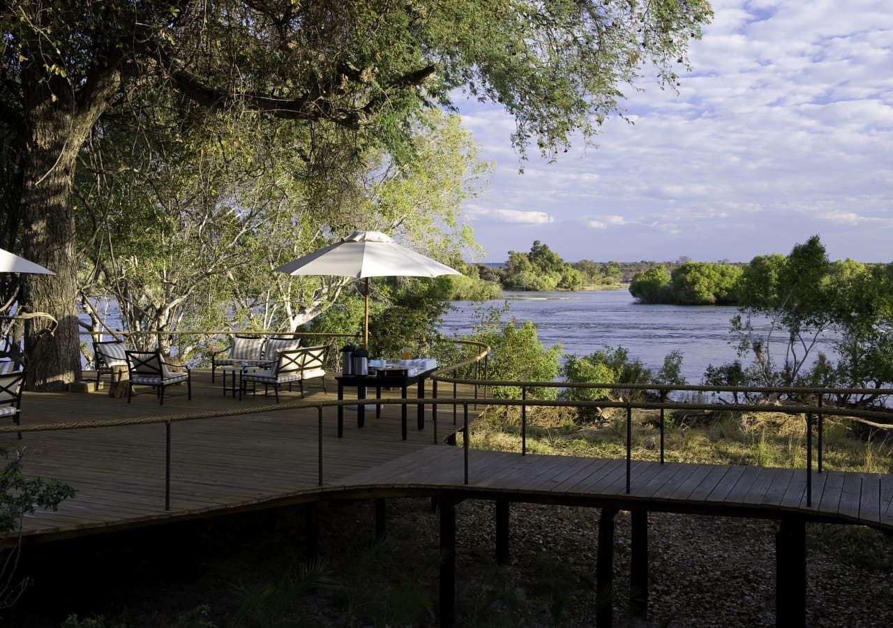 Toka leya camp guest deck area with views across the water 1280