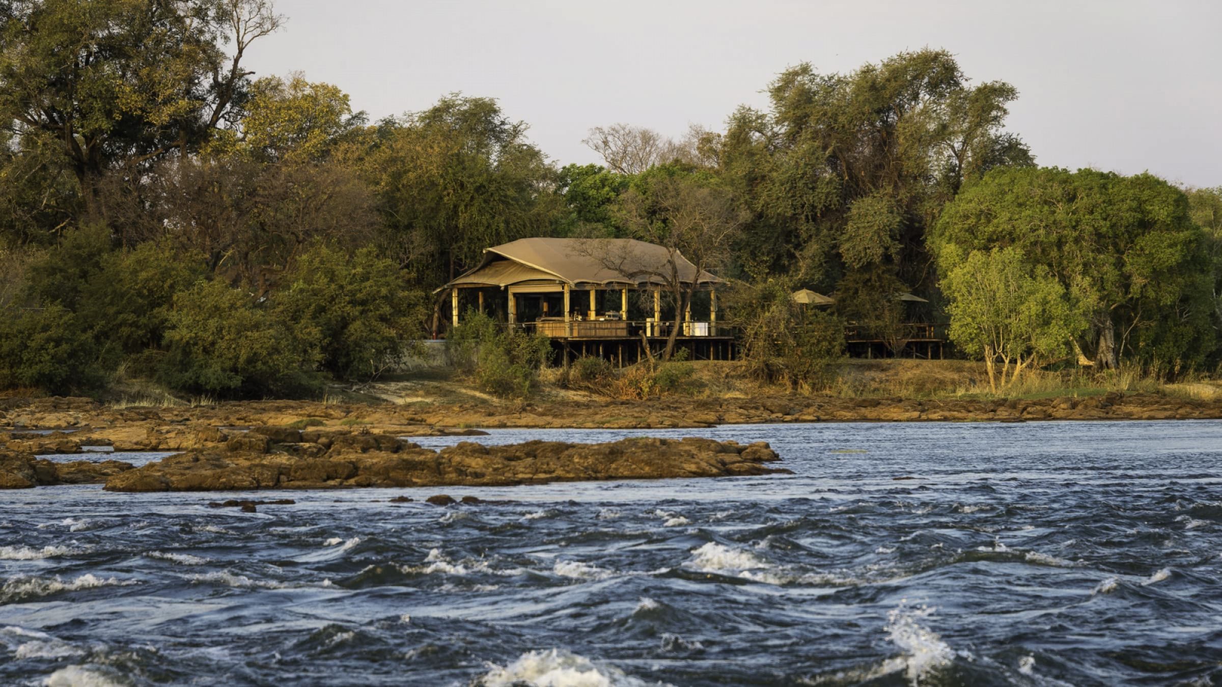 Toka leya camp camp exterior from the water 2400