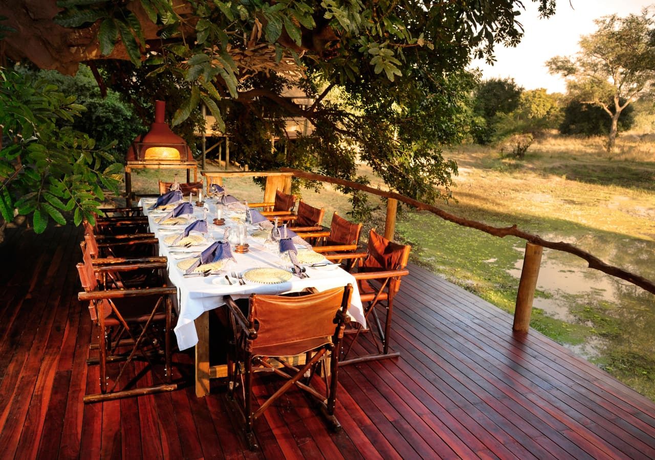 Bilimungwe bushcamp dining on the deck 1280