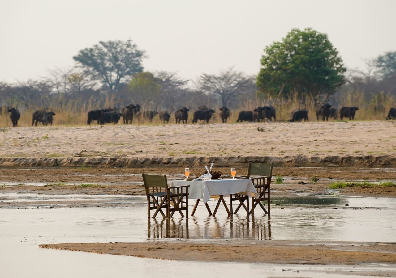 Zungulila bushcamp private dining in the river 1280