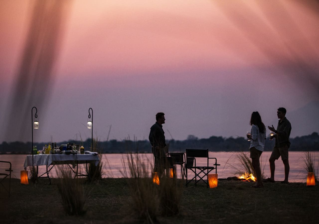 Little ruckomechi camp sundowners at dusk on the zambezi river 1280