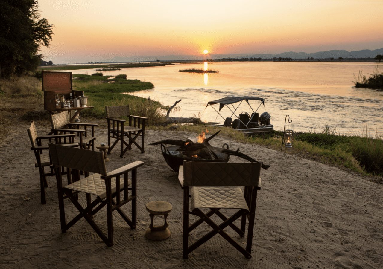 Tembo plains camp sundowners by the water 1280