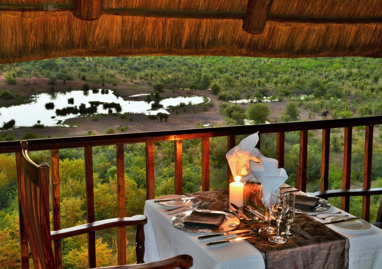 Victoria falls safari suites dining with a view of the water hole 1280