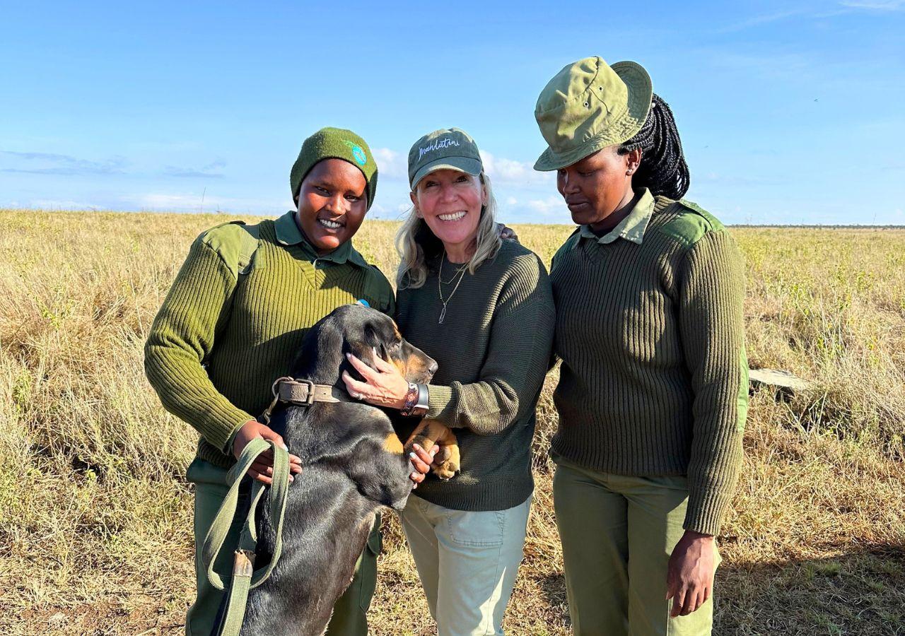 woman meeting an anti-poaching dog unit in Kenya